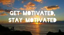 A sunset is happening over the ocean, with clouds in the sky. You can see people’s shadows standing on a rocky beach in front. Big white letters across the sky say, GET MOTIVATED, STAY MOTIVATED.