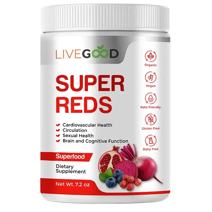 A white container with the label LiveGood Organic Super Reds has pictures of pomegranate, beetroot, berries, and cherry. Symbols on it show that its vegan, keto-friendly, and gluten-free. The label says it can help make your heart and brain healthier.